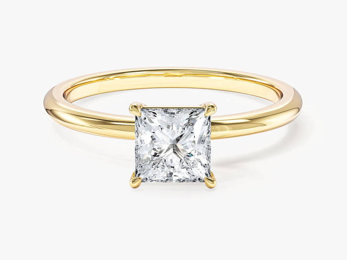 Princess cut lab grown diamond solitaire engagement ring on a thin yellow gold band, front view