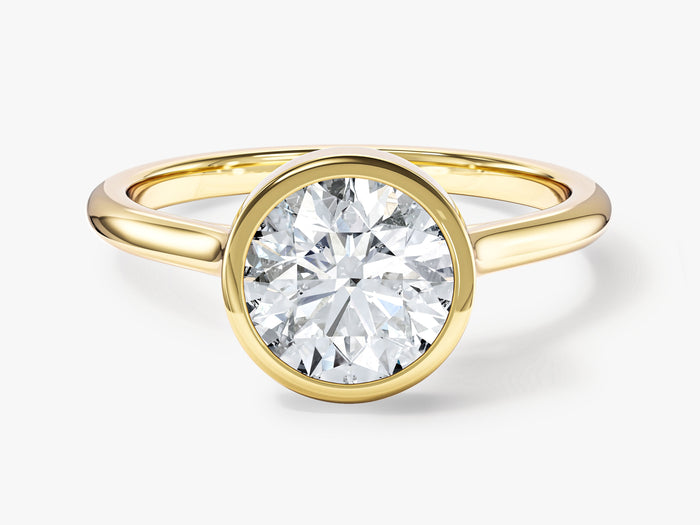 Round lab grown diamond full bezel minimalist solitaire ring in yellow gold, front view