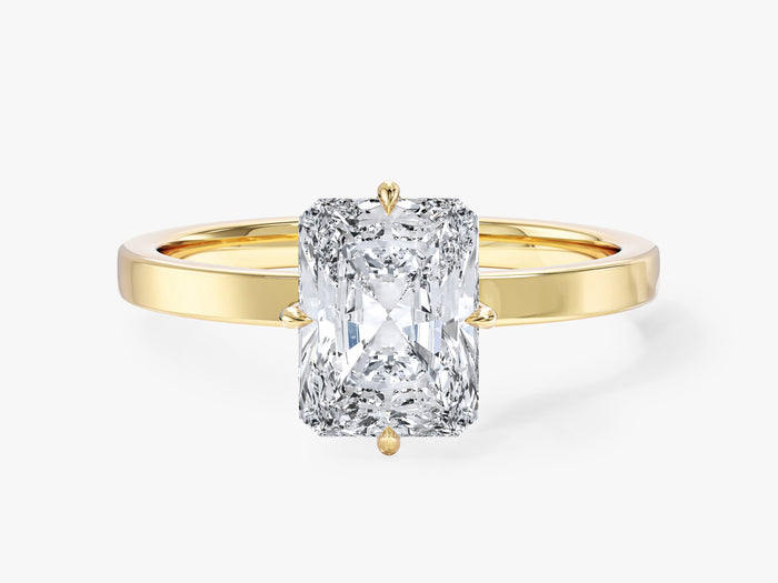 Radiant cut lab grown diamond compass prong solitaire on a flat band in yellow gold, front view