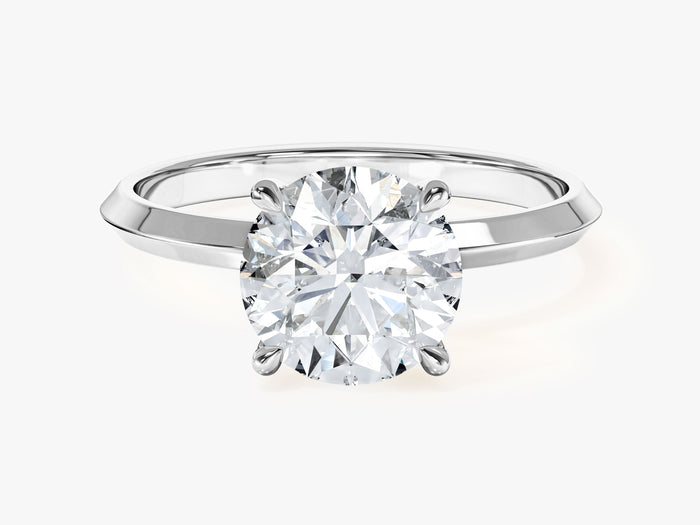 Round lab grown diamond four claw engagement ring with knife edge band in white gold, front view