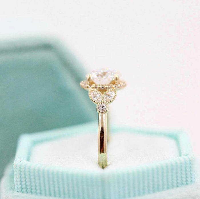 Round brilliant moissanite milgrain halo engagement ring with marquise panel shoulders in yellow gold, view 2