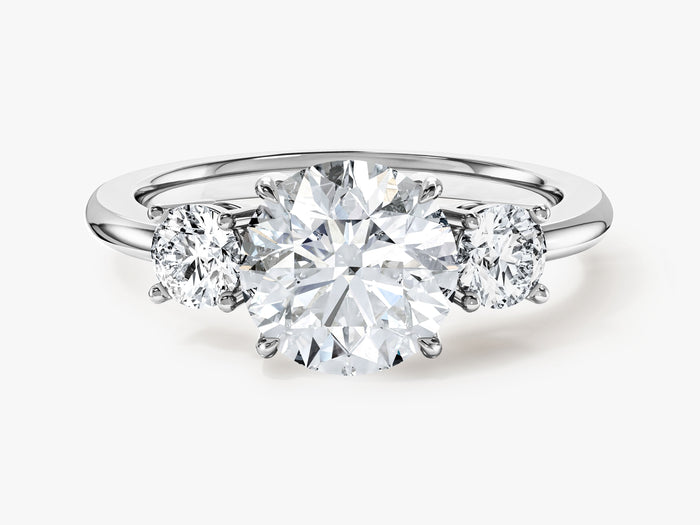 Round lab grown diamond trilogy engagement ring in white gold, front view