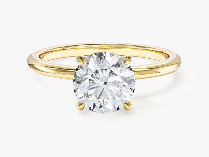 Round brilliant lab grown diamond under halo engagement ring in yellow gold, front view