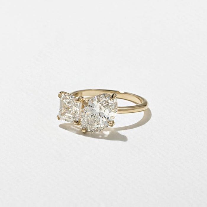 Oval and asscher cut moissanite toi et moi engagement ring in yellow gold, view 2