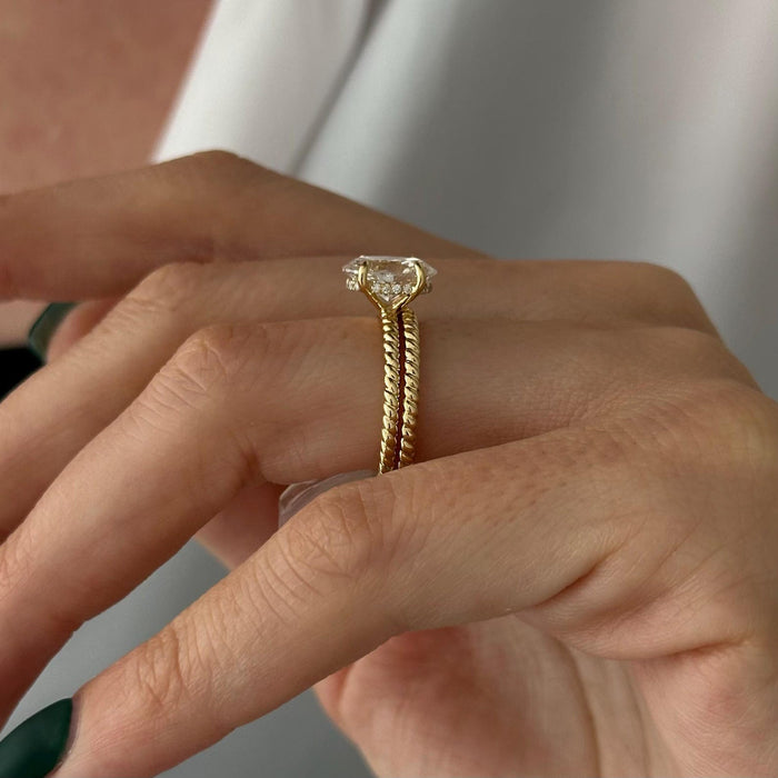 Side view of oval lab grown diamond ring showing the hidden halo above a twisted rope shank