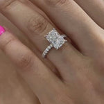 Load and play video in Gallery viewer, Hidden Halo Radiant Moissanite Ring