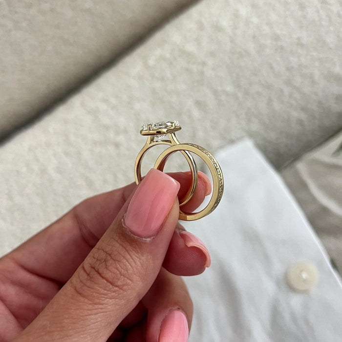 Profile of radiant lab grown diamond bezel ring showing the open gallery next to the pave band