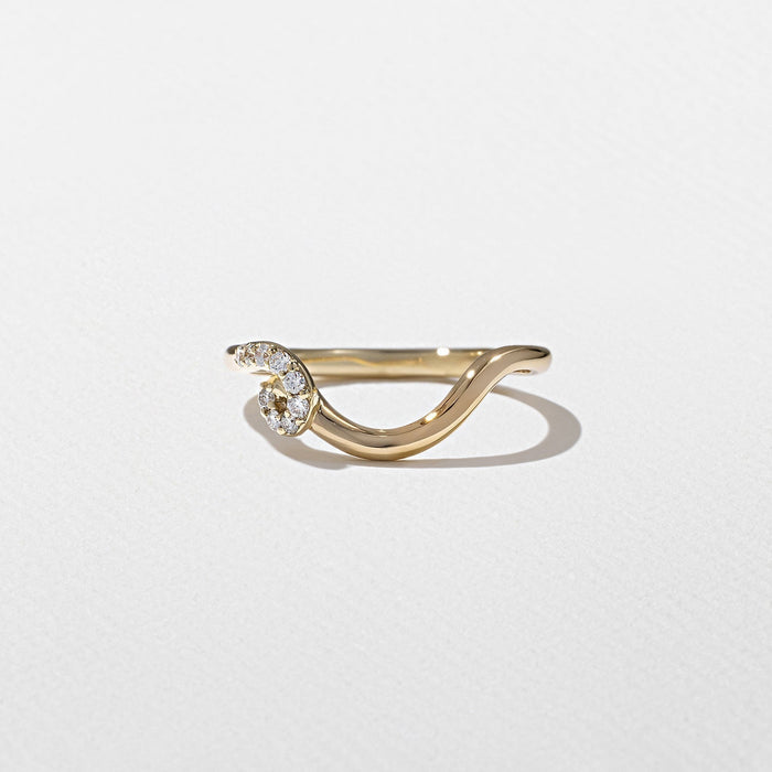 Round moissanite curved swirl wedding band in yellow gold front view