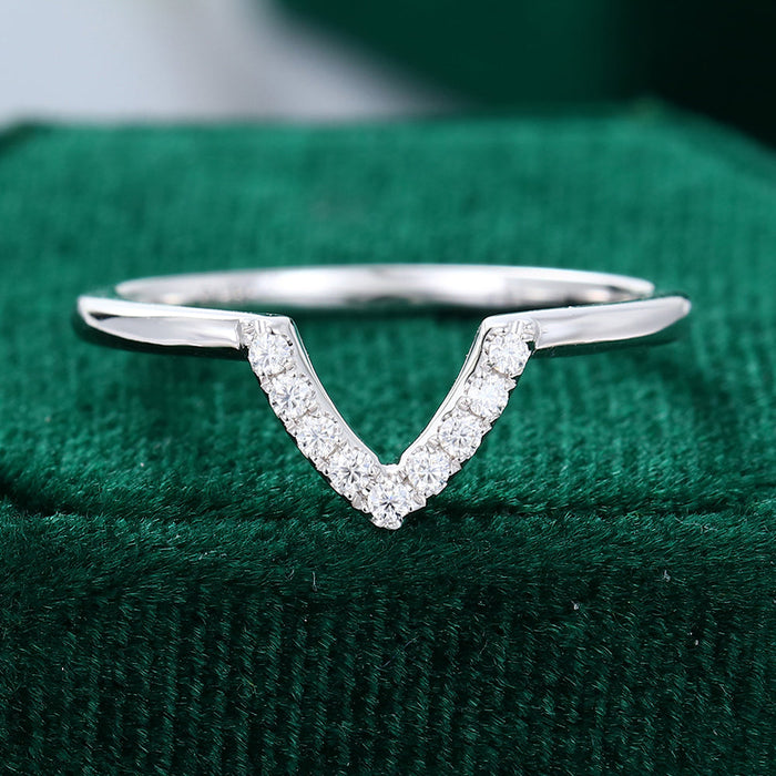 Round moissanite deep v-shaped curved wedding band, front view in white gold