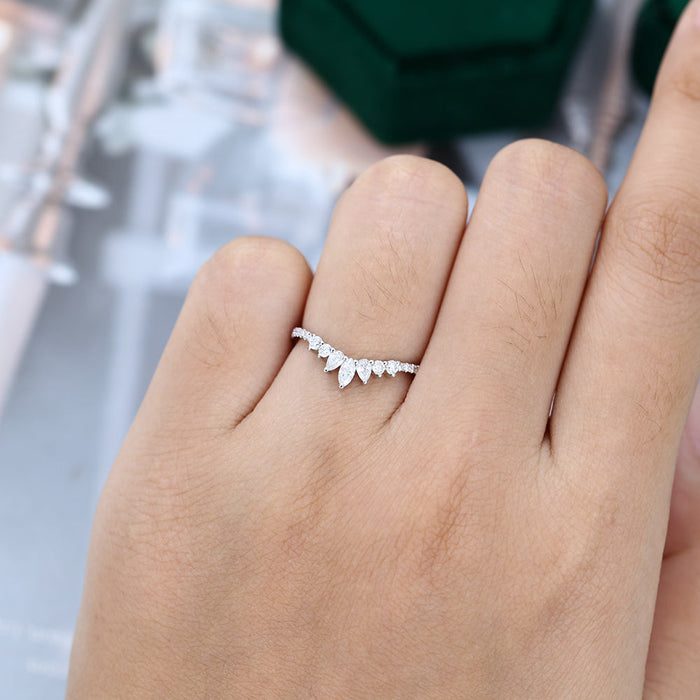 Round, Pear and Marquise moissanite pave crown curved wedding band, worn on the finger in white gold