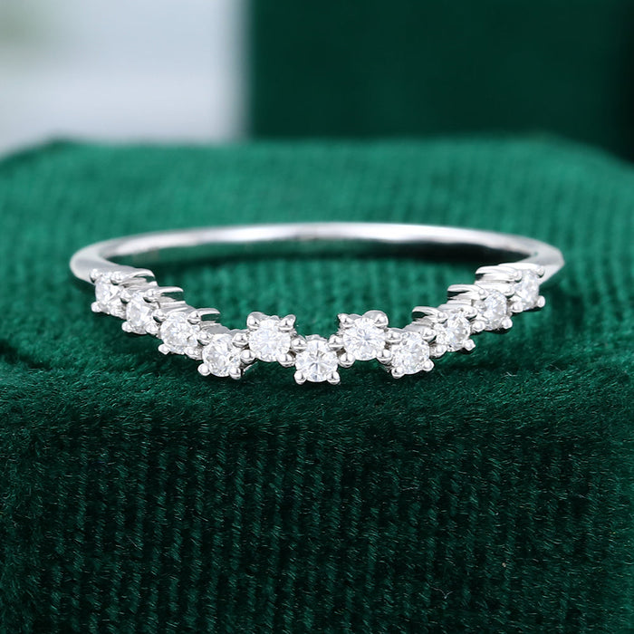 Round moissanite scattered cluster curved wedding band, front view in white gold