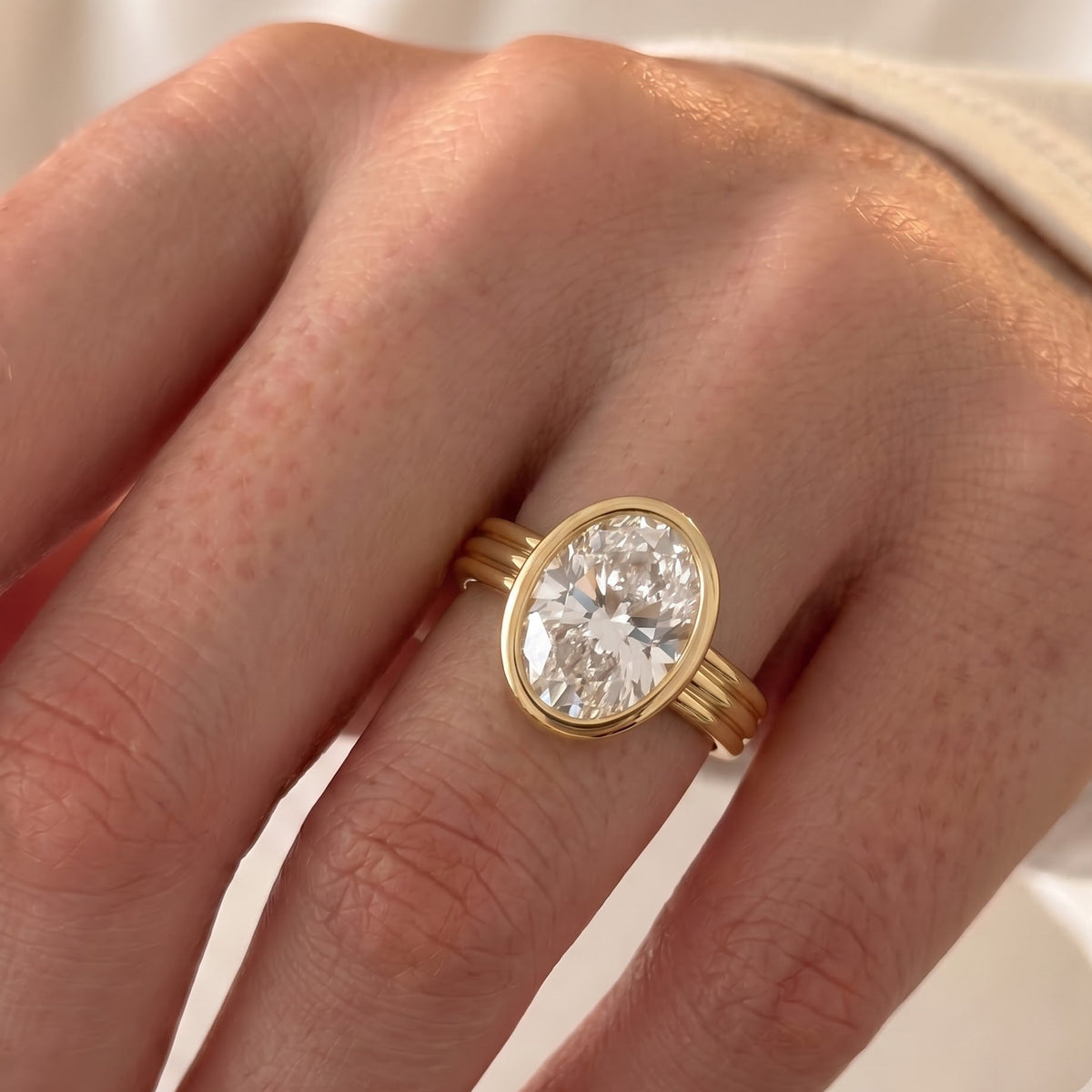 Phoebe Dynevor's Engagement Ring: The Oval Bezel in Yellow Gold