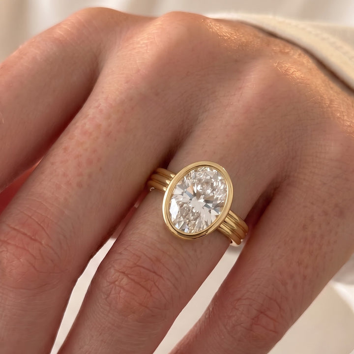 Phoebe Dynevor's Engagement Ring: The Oval Bezel in Yellow Gold