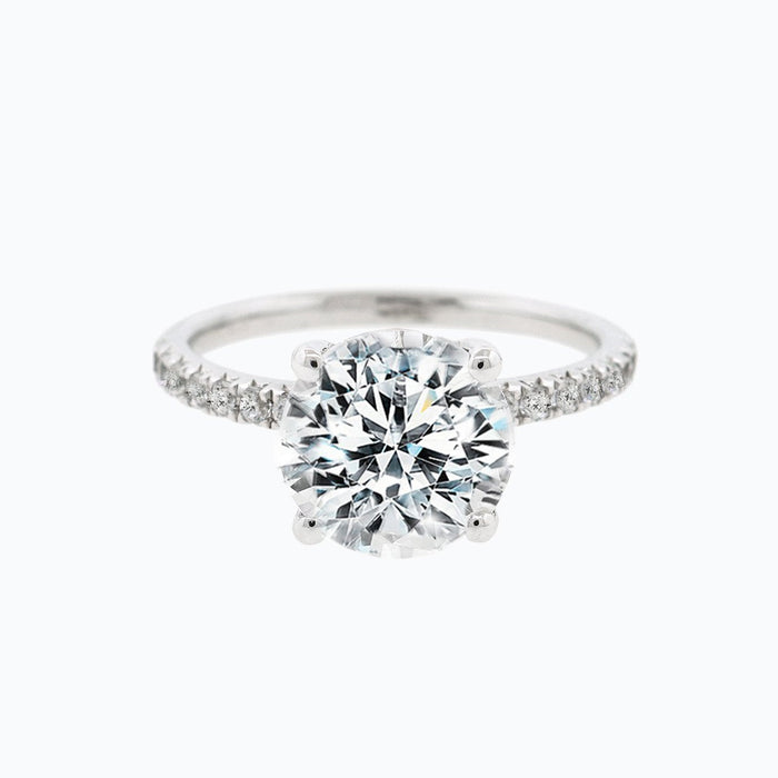 Front view of the round brilliant centre on a pave set yellow gold band