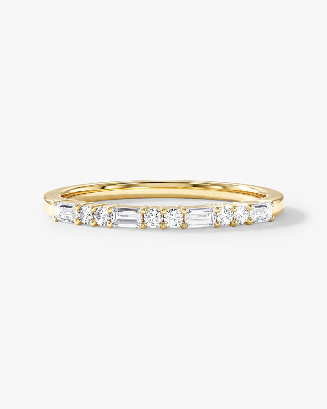Baguette and round moissanite half eternity wedding band in yellow gold, front view