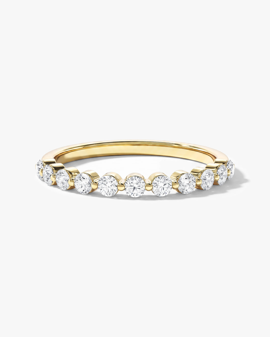Round moissanite floating eleven stone anniversary band in yellow gold, front view