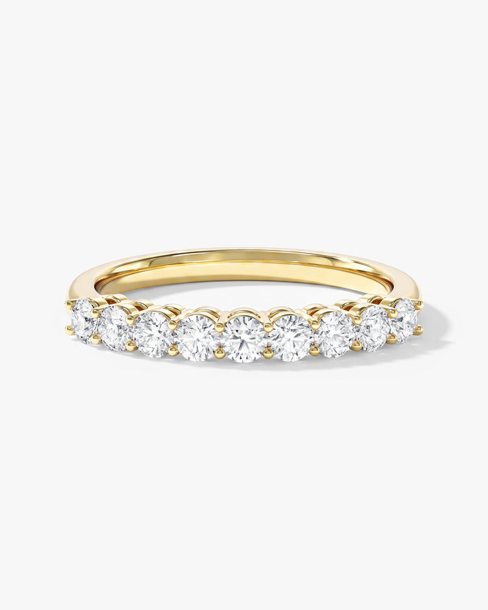 Round moissanite classic nine stone anniversary band in yellow gold, front view