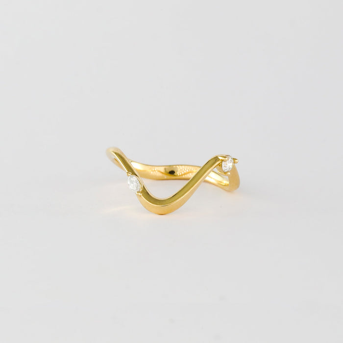 Marquise and round moissanite curved wave wedding band in yellow gold