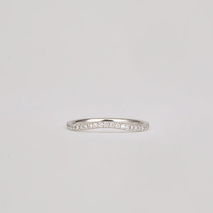 Round moissanite curved pave wedding band in white gold, front view