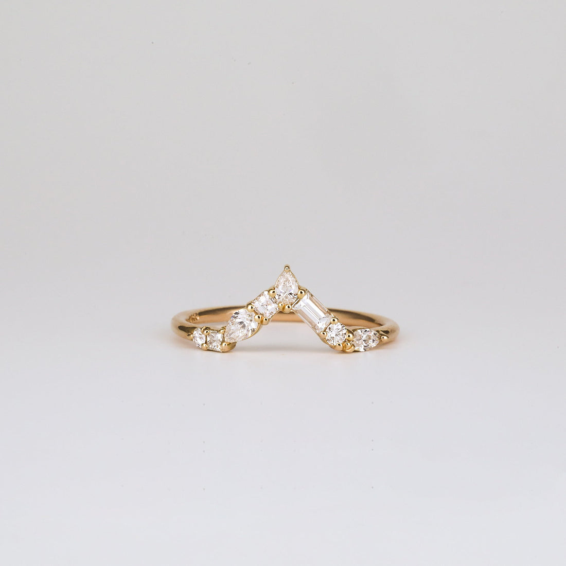 Mixed shape lab grown diamond curved cluster wedding band in yellow gold, front view
