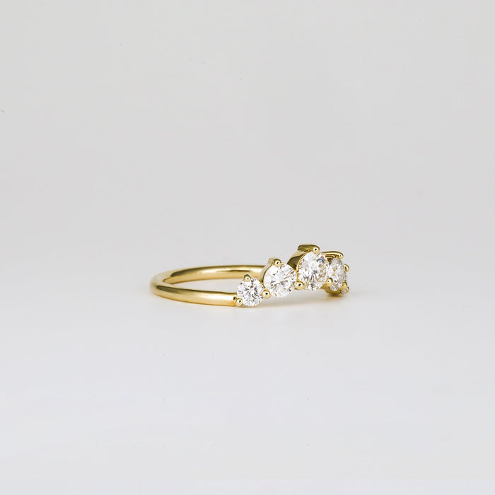 Round moissanite five stone curved wedding band, side view