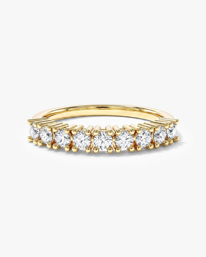 Round moissanite nine stone basket anniversary band in yellow gold, front view