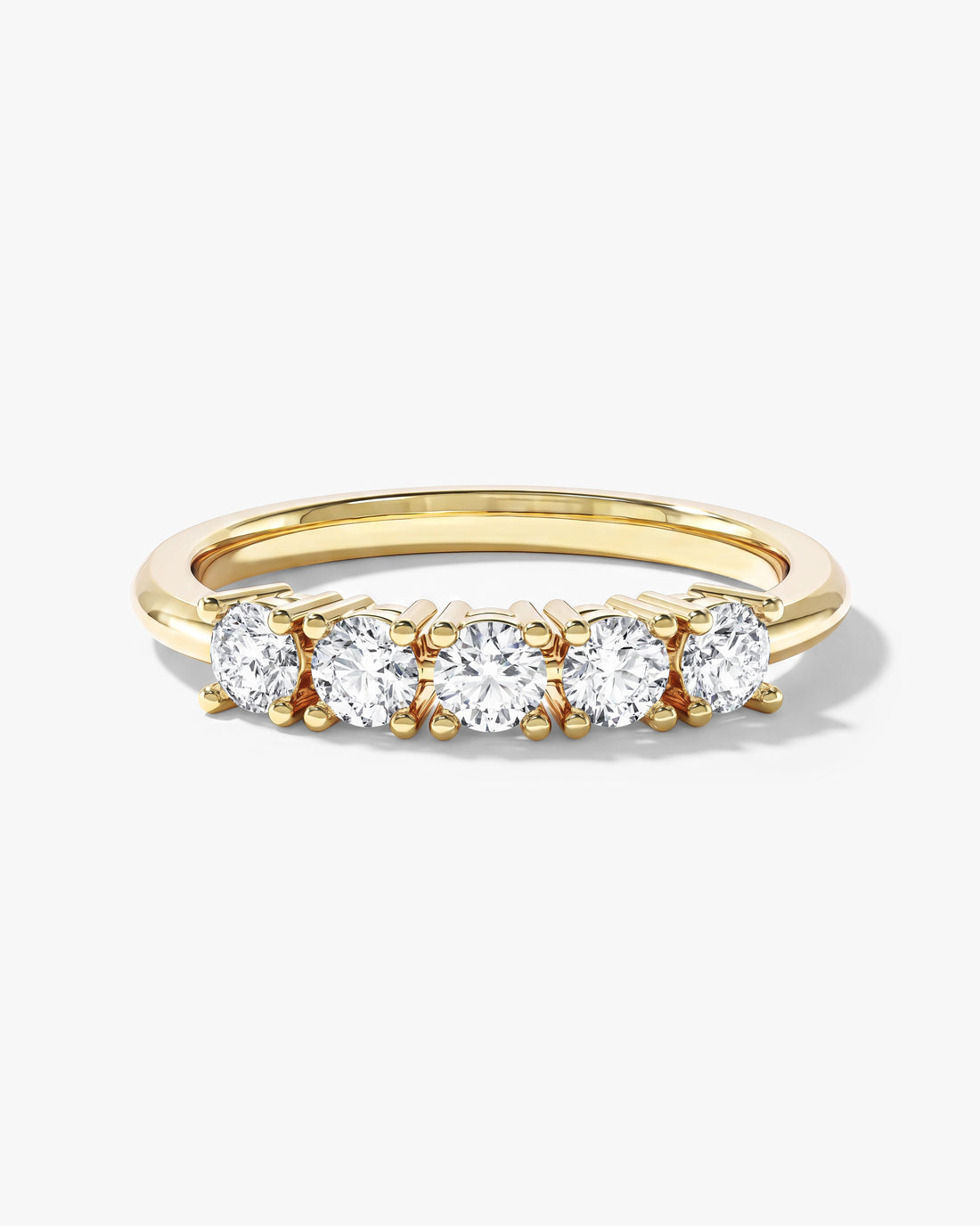 Round moissanite five stone basket anniversary band in yellow gold, front view