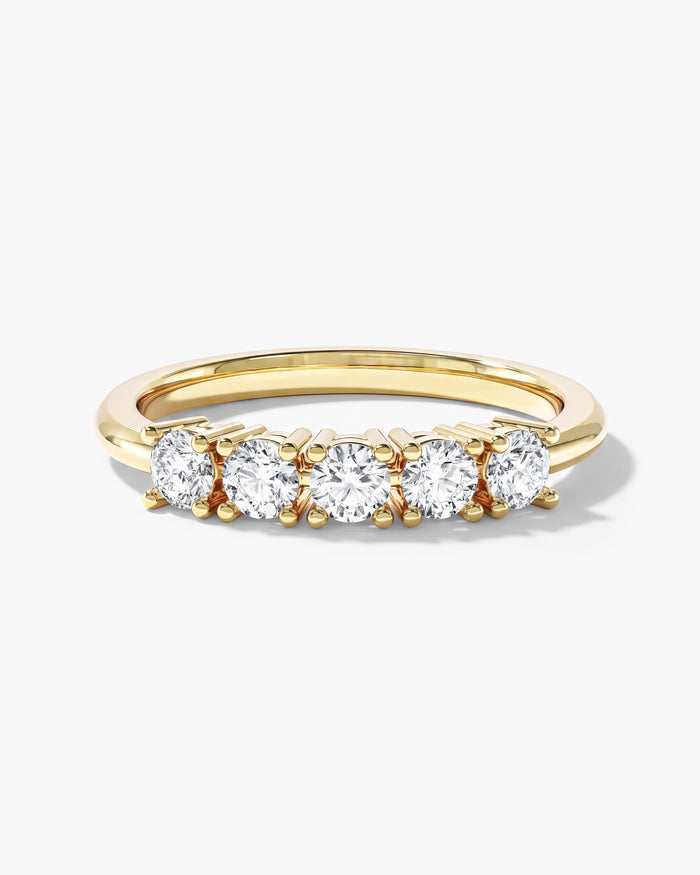 Round moissanite five stone basket anniversary band in yellow gold, front view