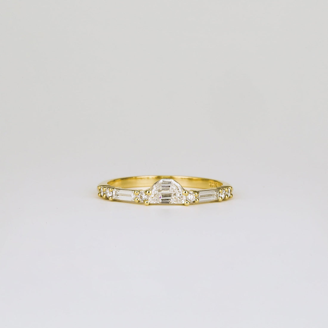 Half moon, round and baguette lab grown diamond half eternity wedding band in yellow gold, front view