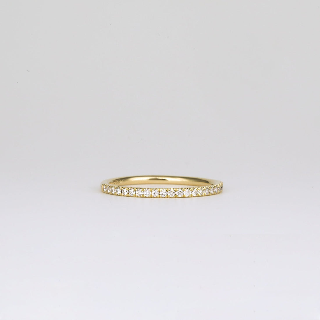 Round lab grown diamond pave half eternity band in yellow gold, front view