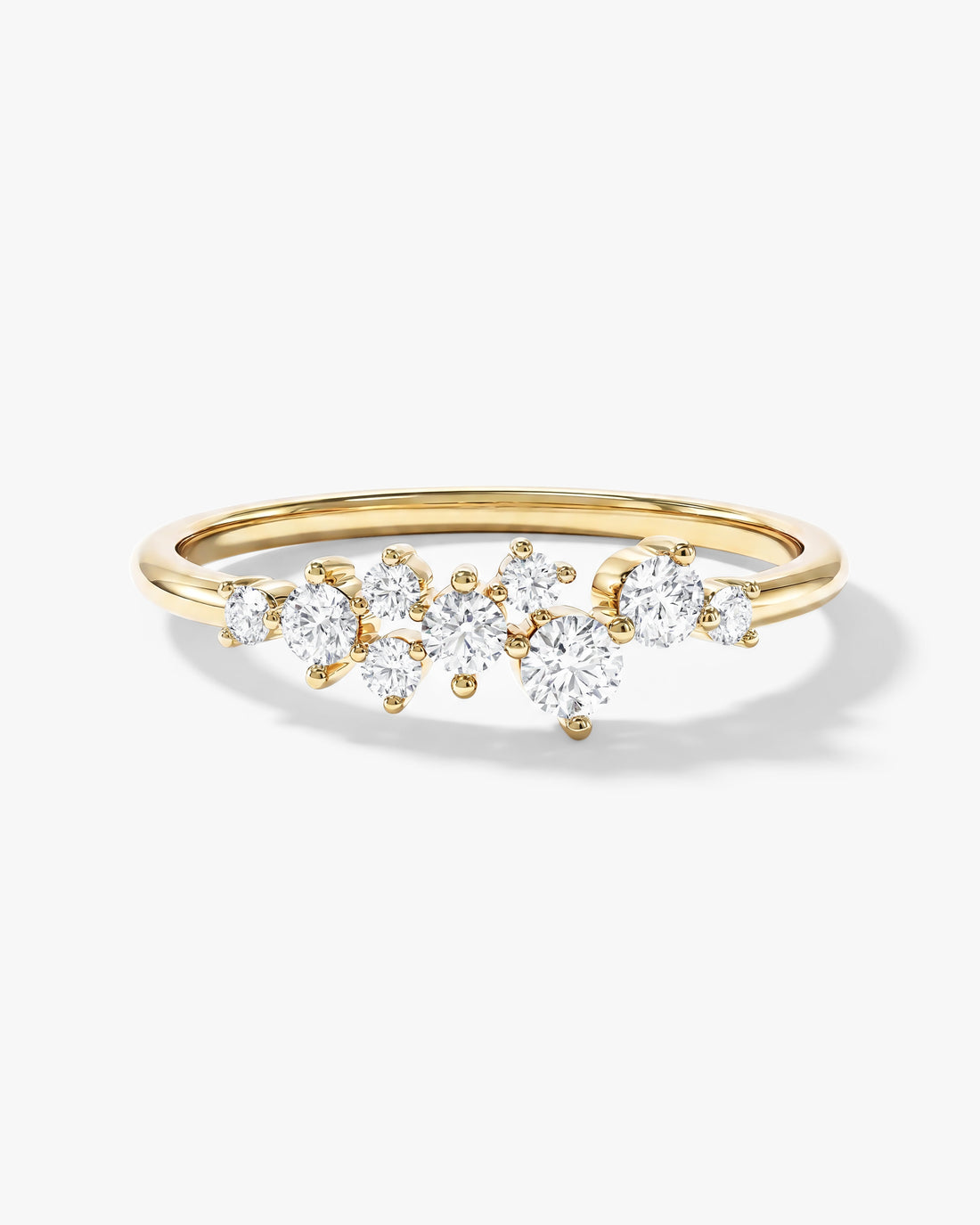 Round moissanite floating cluster wedding band in yellow gold, front view