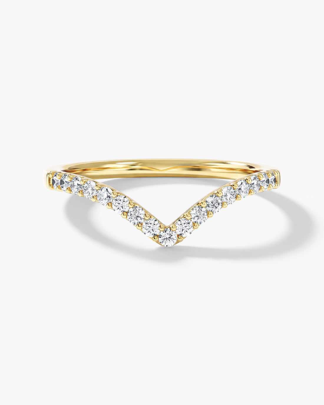 Round moissanite chevron curved wedding band in yellow gold, front view