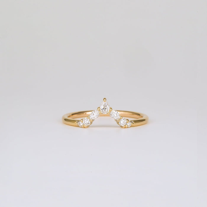 Pear, marquise and round moissanite V shaped curved wedding band in yellow gold, front view
