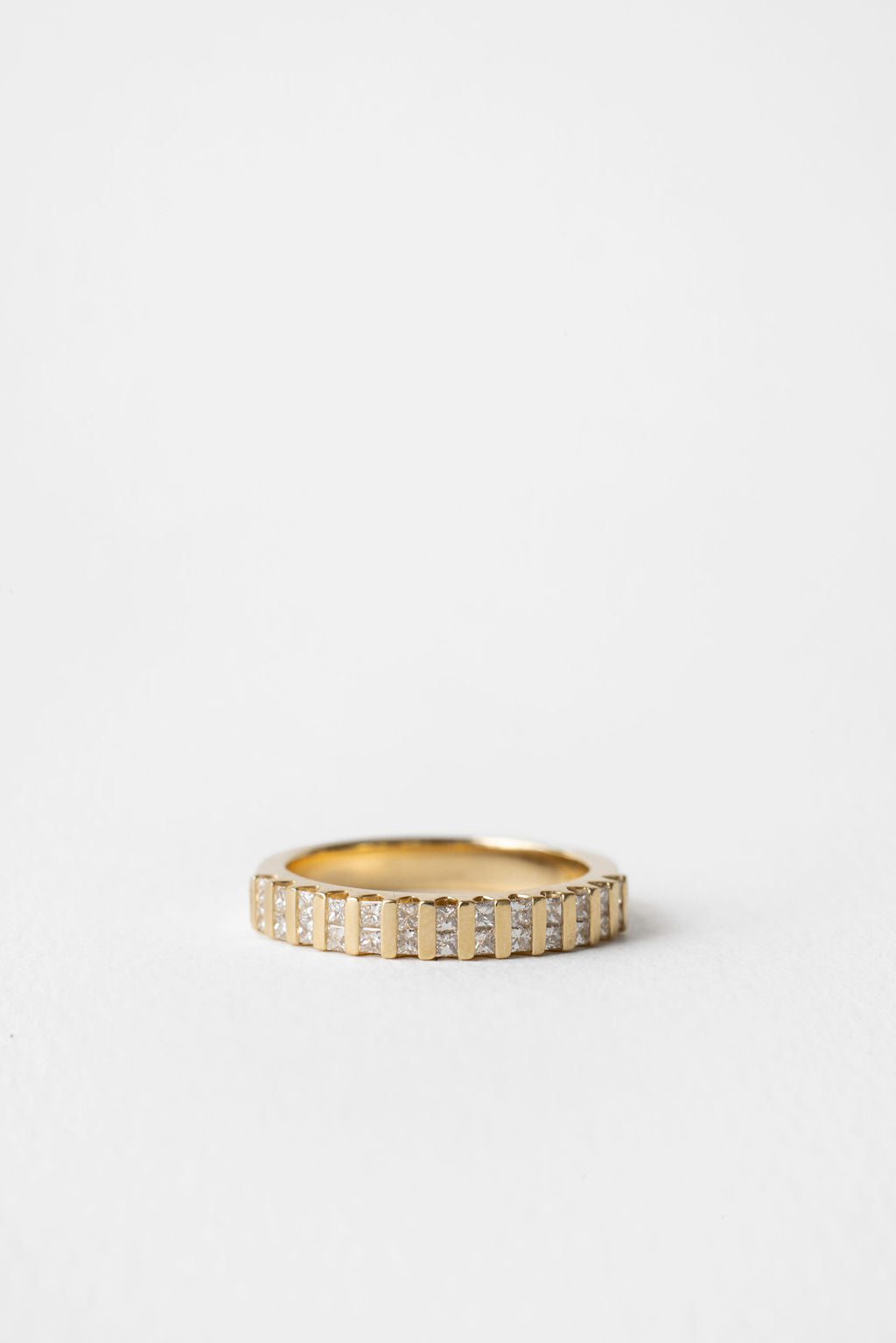 Princess cut lab grown diamond bar channel set wedding band in yellow gold, front view