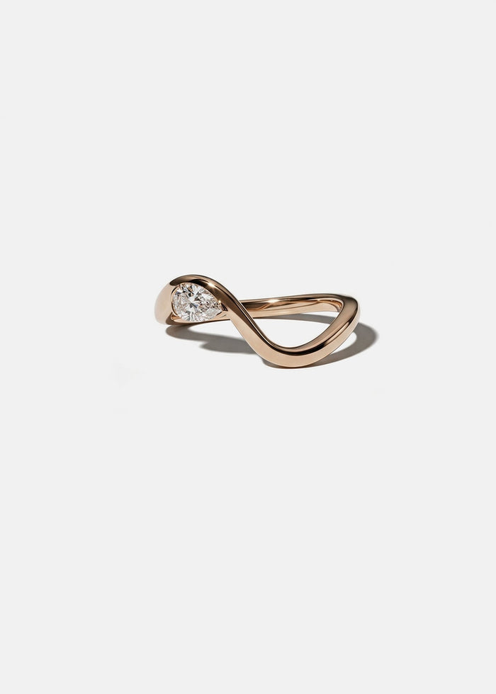 Pear moissanite curved wedding band in rose gold, front view