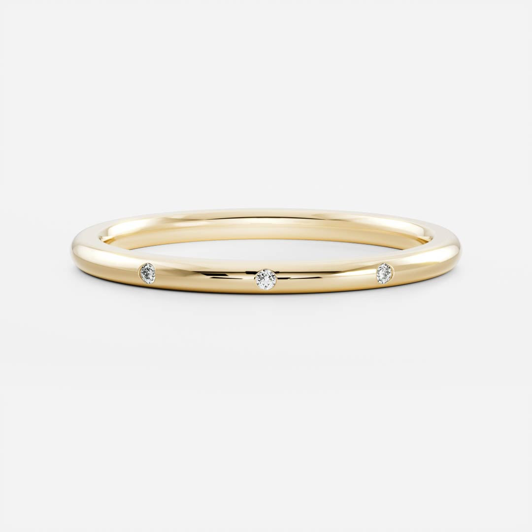 Round lab grown diamond flush set wedding band in yellow gold, front view