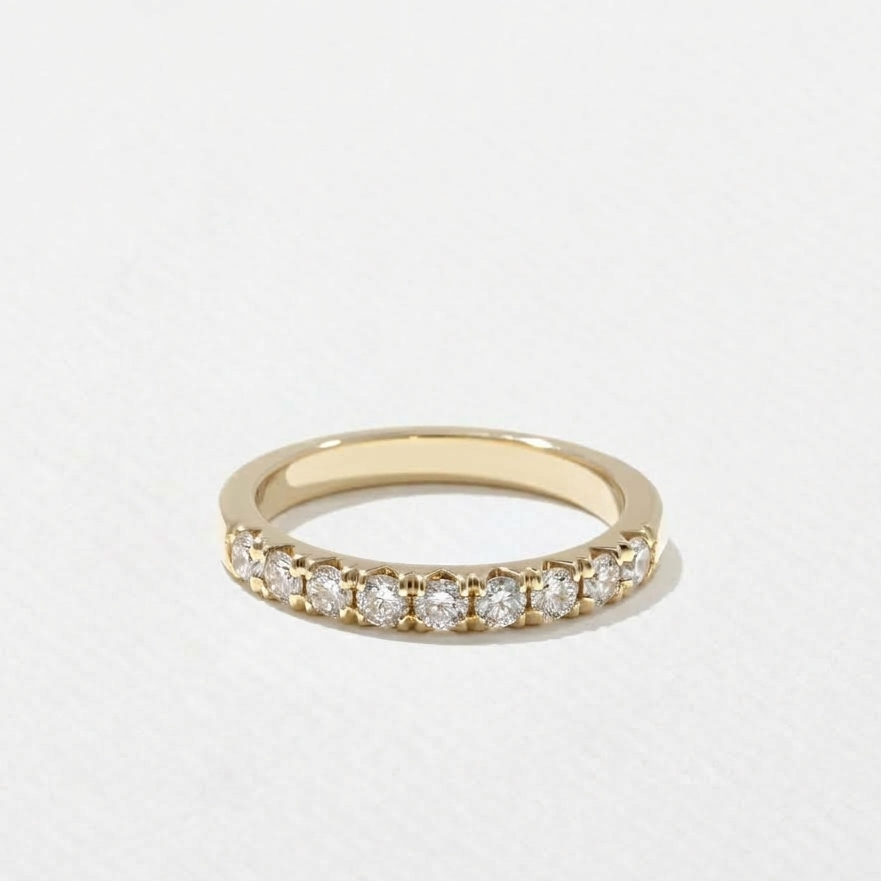 Round lab grown diamond shared prong half eternity wedding band in yellow gold