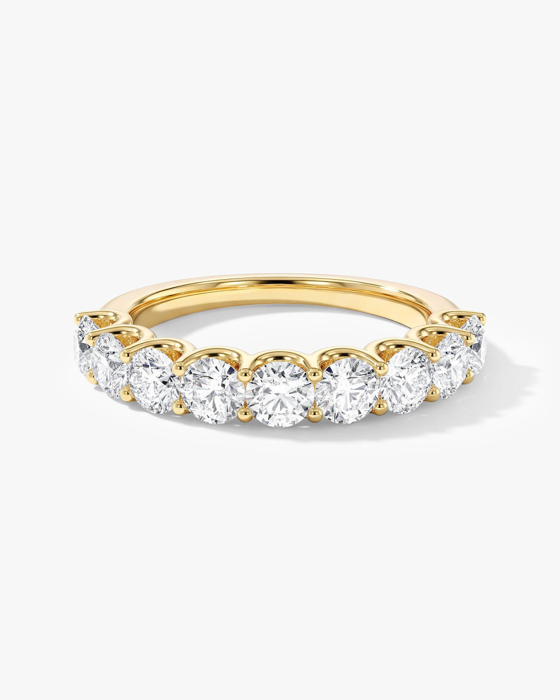 1.50 carat round moissanite U-prong half eternity wedding band in yellow gold