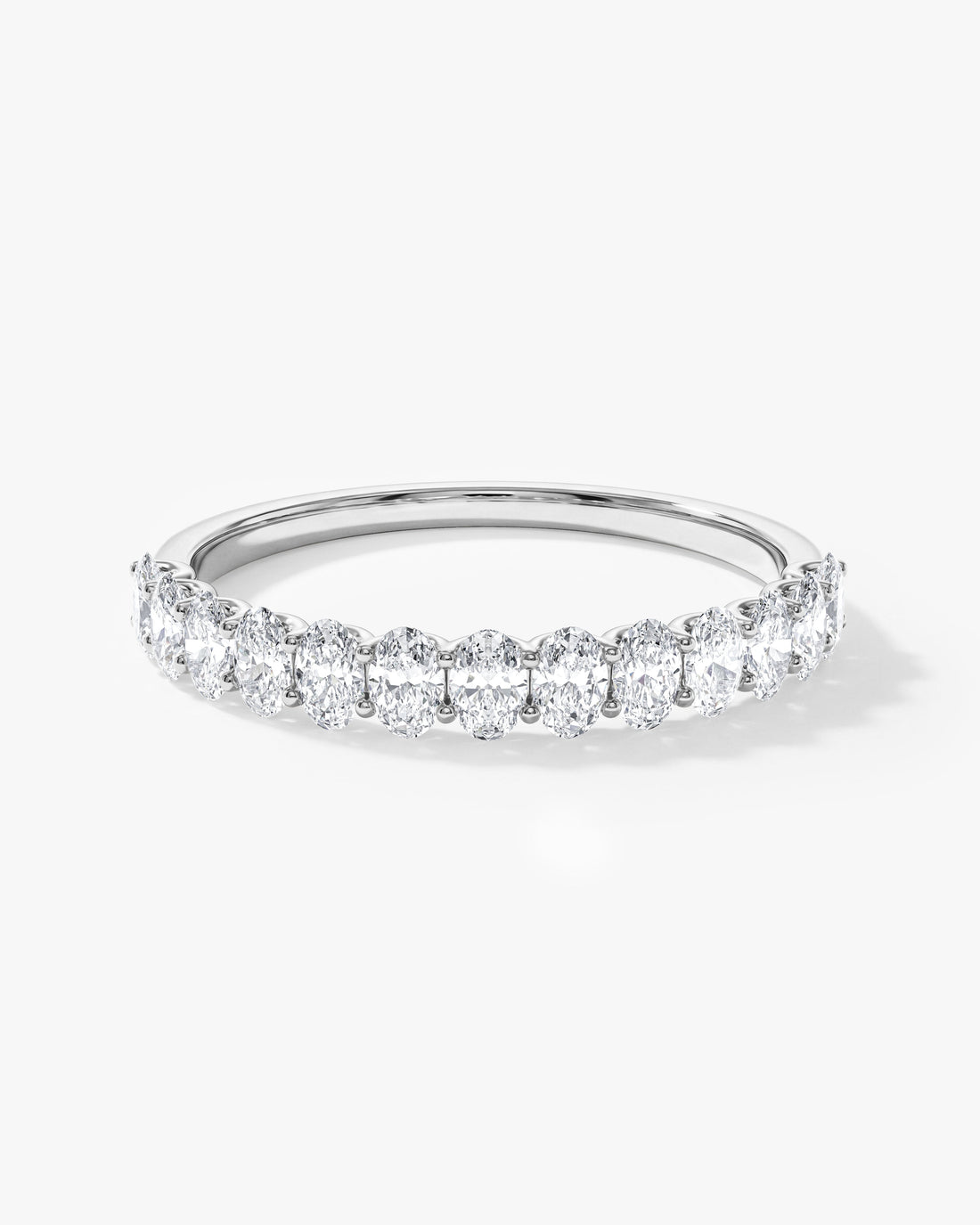 0.75 carat oval moissanite U-prong half eternity wedding band in white gold