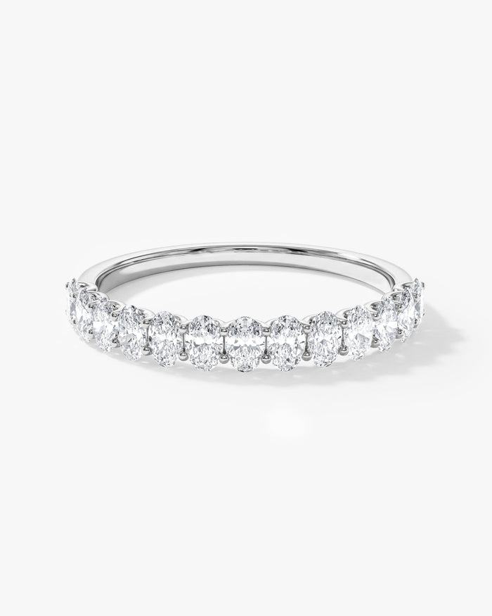 0.75 carat oval moissanite U-prong half eternity wedding band in white gold