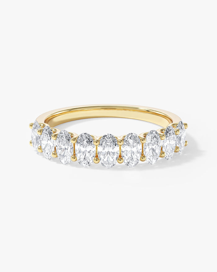 2.50 carat oval moissanite U-prong half eternity wedding band in yellow gold