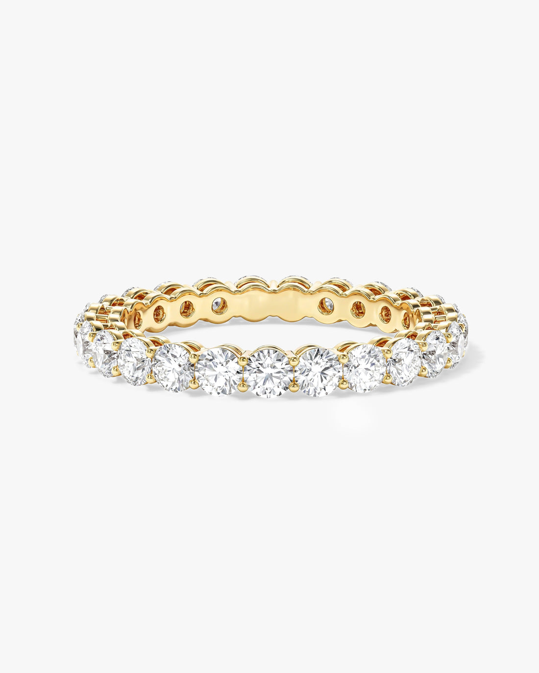 1.50 carat round moissanite shared prong eternity wedding band in yellow gold