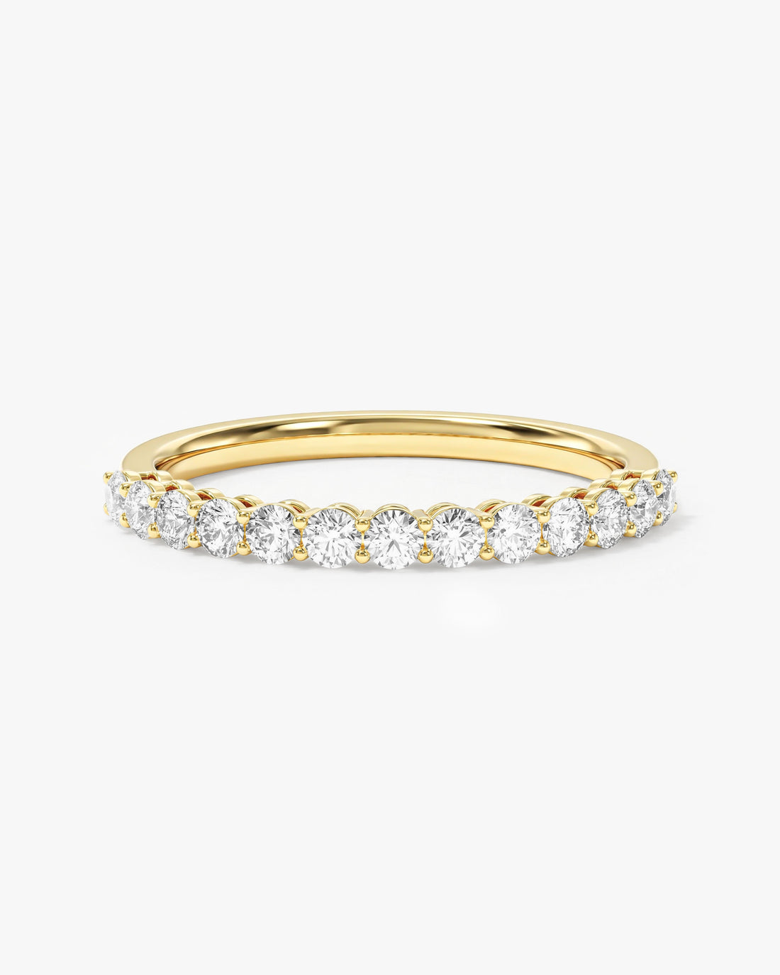 2mm round moissanite shared prong half eternity wedding band in yellow gold
