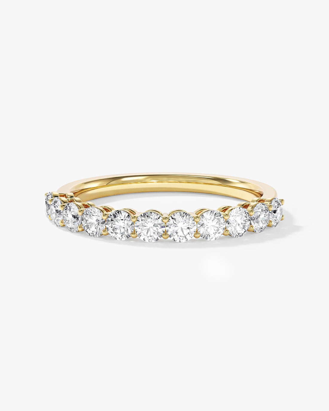 2.5mm round moissanite shared prong half eternity wedding band in yellow gold