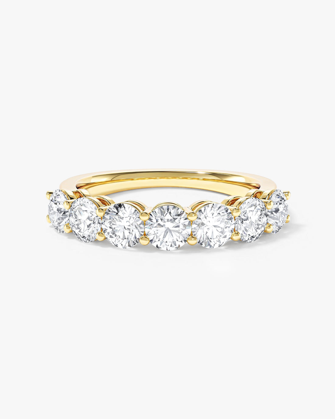 4mm round moissanite shared prong half eternity wedding band in yellow gold