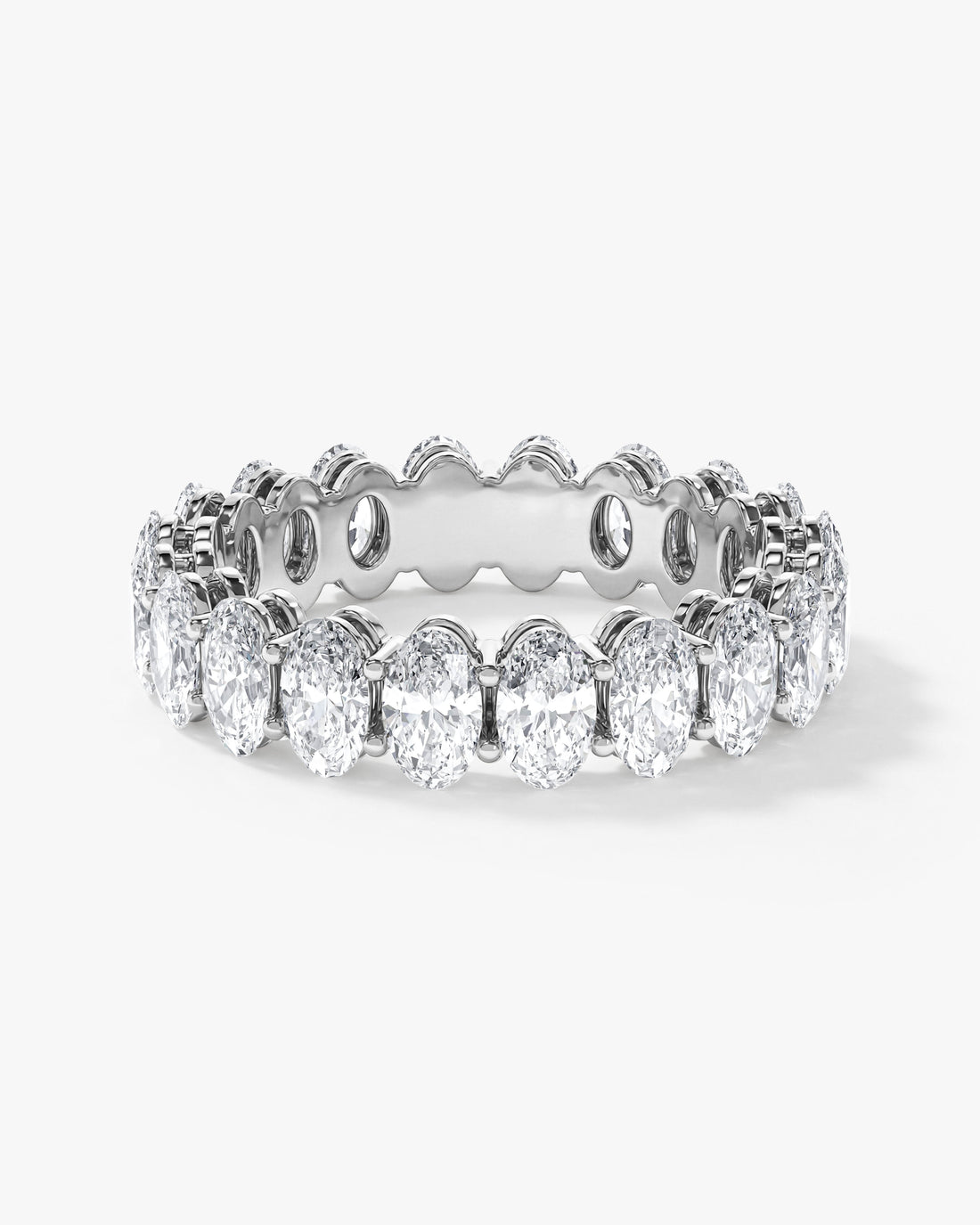5mm oval moissanite shared prong eternity wedding band in yellow gold