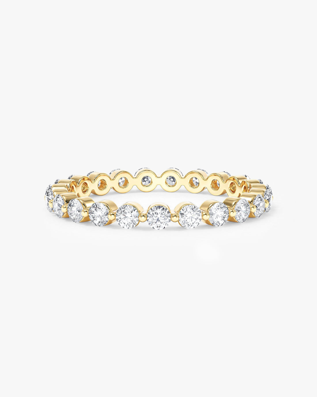 2mm round moissanite single prong eternity wedding band in yellow gold