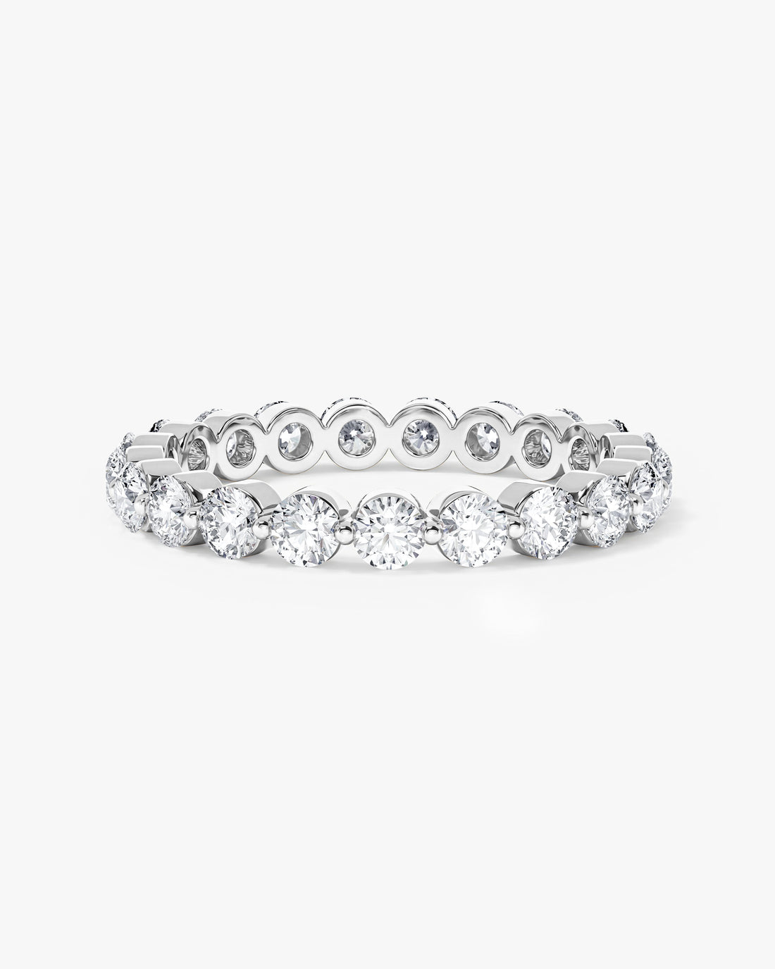 2.5mm round moissanite single prong eternity wedding band in yellow gold