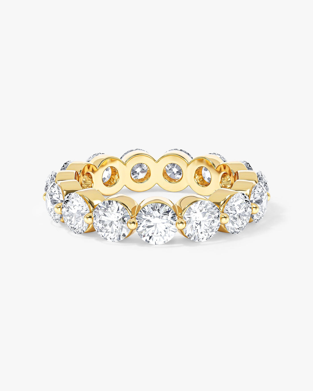 4mm round moissanite single prong eternity wedding band in yellow gold