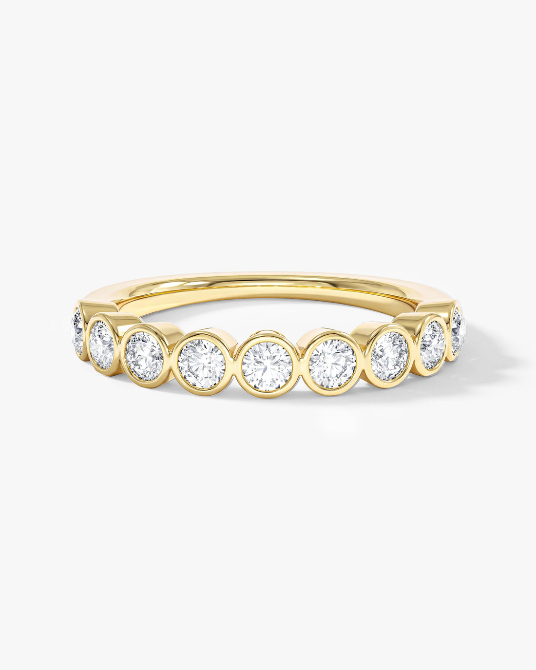 Round moissanite bezel half eternity wedding band in yellow gold, front view